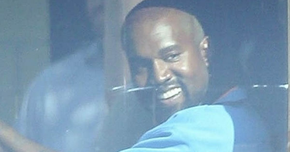 Kanye West grins as he takes car out for a spin after hospital dash