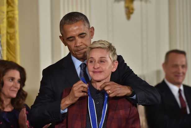 US President Barack Obama presents actress and comedian Ellen DeGeneres with the Presidential Medal of Freedom