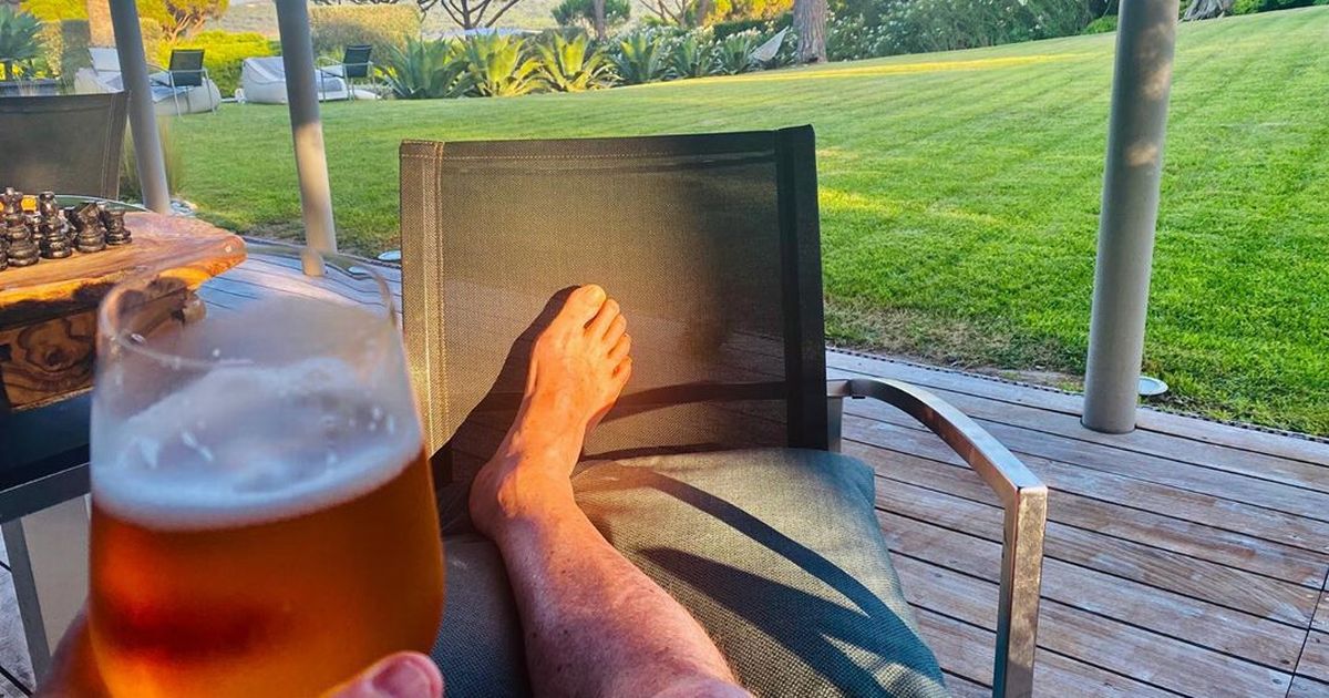 Piers Morgan medicating himself with beer after spraining his ankle on holiday