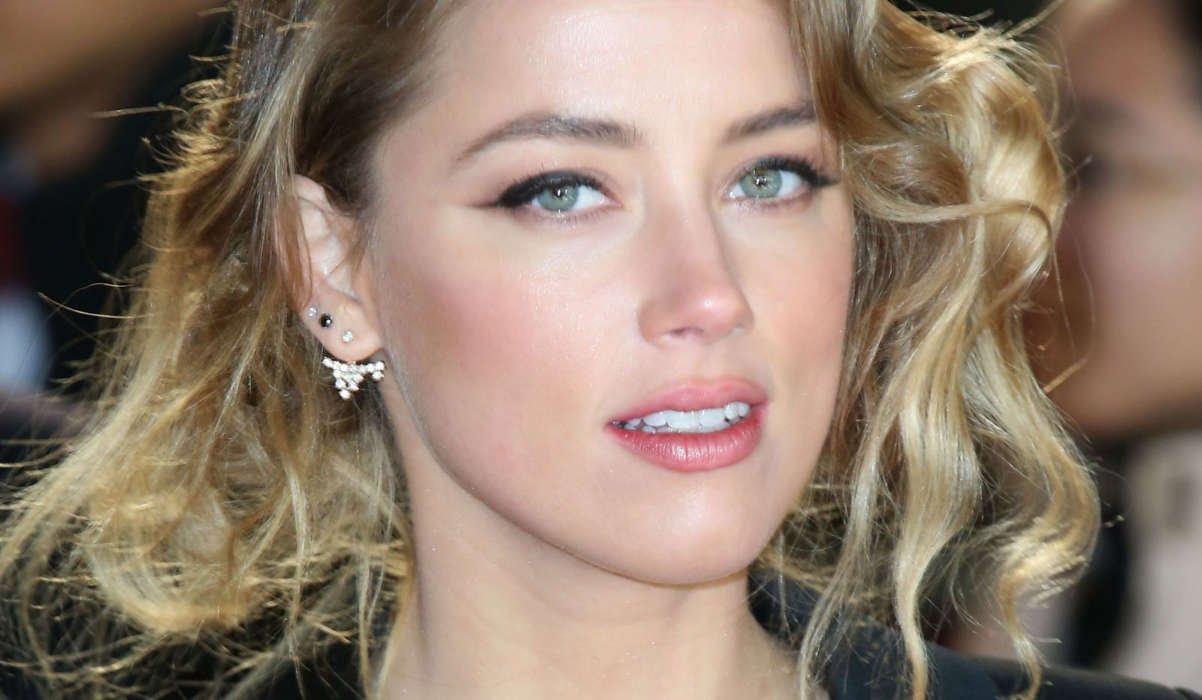 Amber Heard Says Johnny Depp Once Threw 30 Bottles At Her Head In 2015