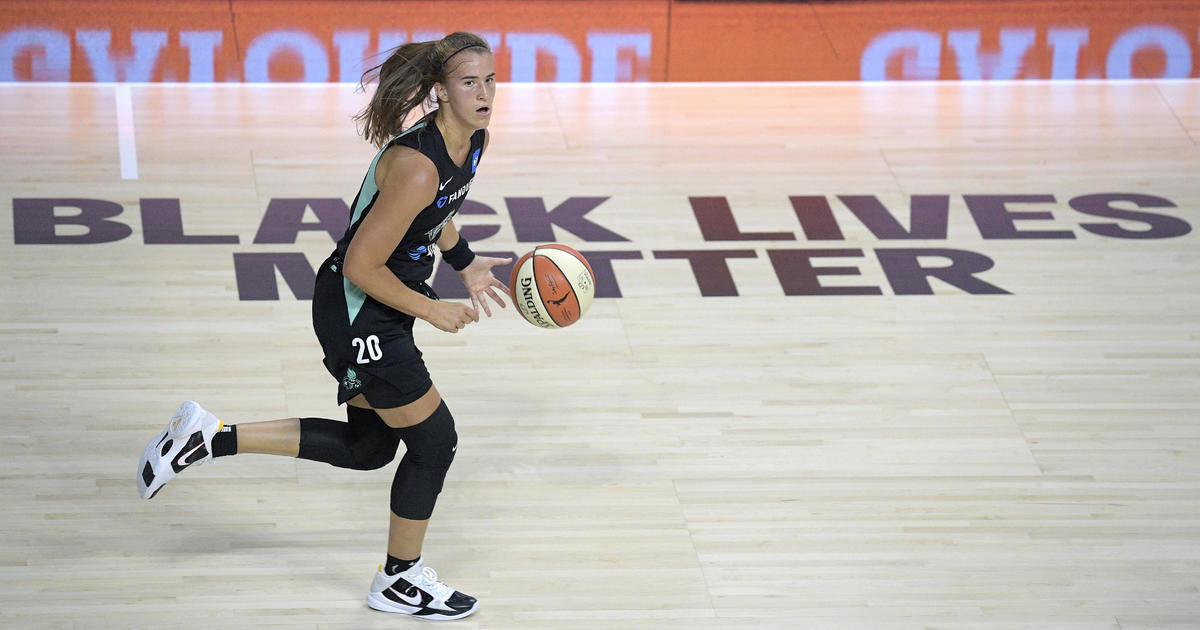 WNBA players walk off court before national anthem