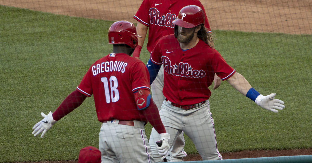 Opening day: Empty parks, fake crowd noise and air high-fives