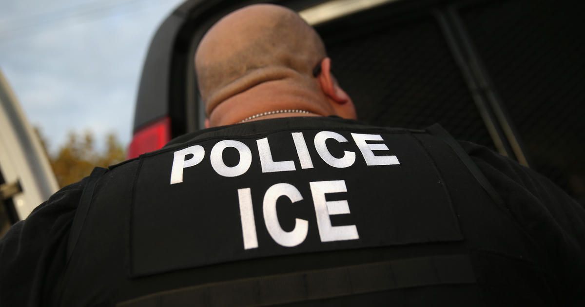 Crowd surrounds buses holding two ICE detainees