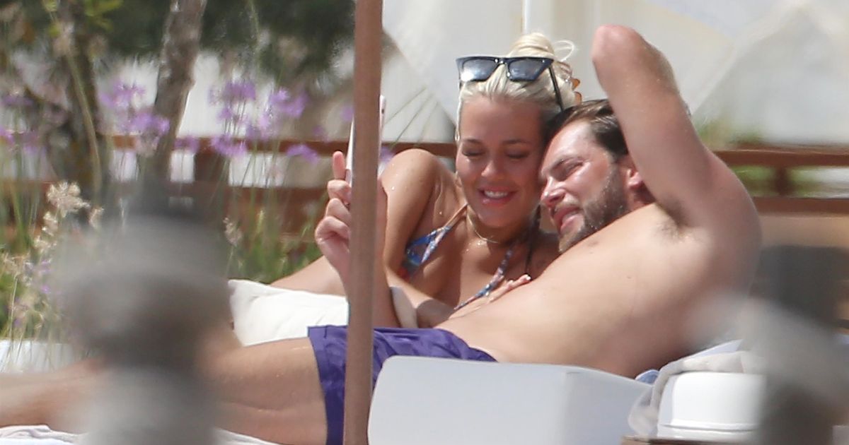 Lewis Burton and Lottie Tomlinson look absolutely smitten on Ibiza holiday