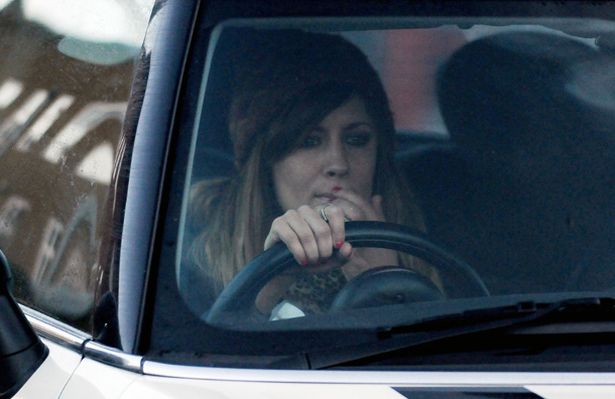 Caroline Flack looks tearful after saying goodbye to Harry Styles