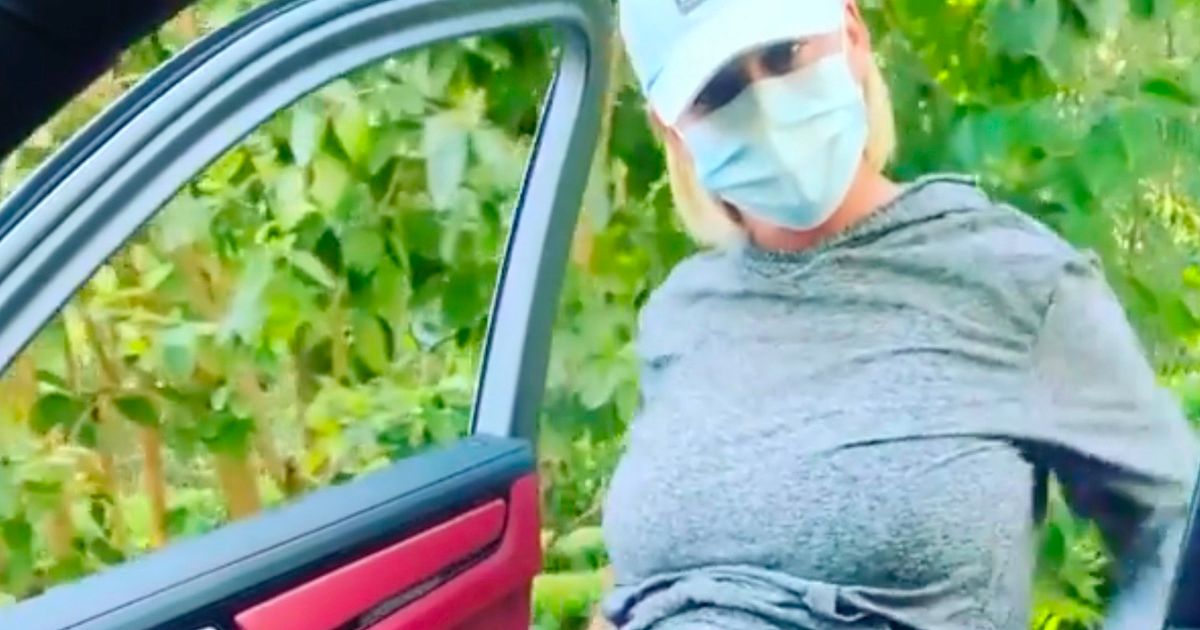 Katy Perry shows off bump as she boogies next to moving car for viral challenge