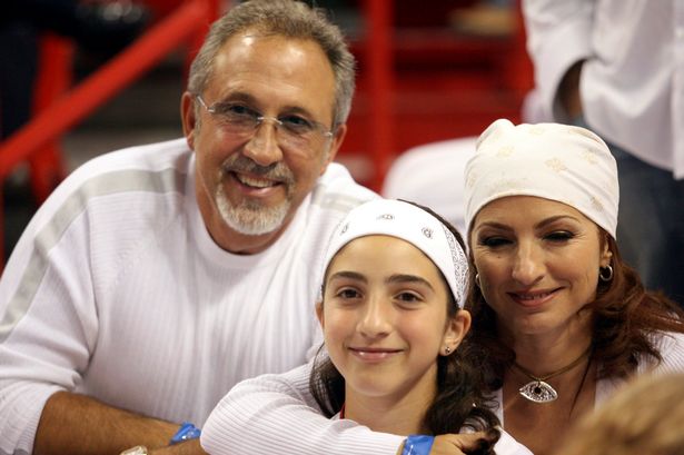 Singer Gloria Estefan, her husband Emilio and her daughter Emily pose during the first half of game three between the Miami Heat and the Chicago Bulls in the first round of NBA playoff action in Miami, Florida, April 27, 2007.