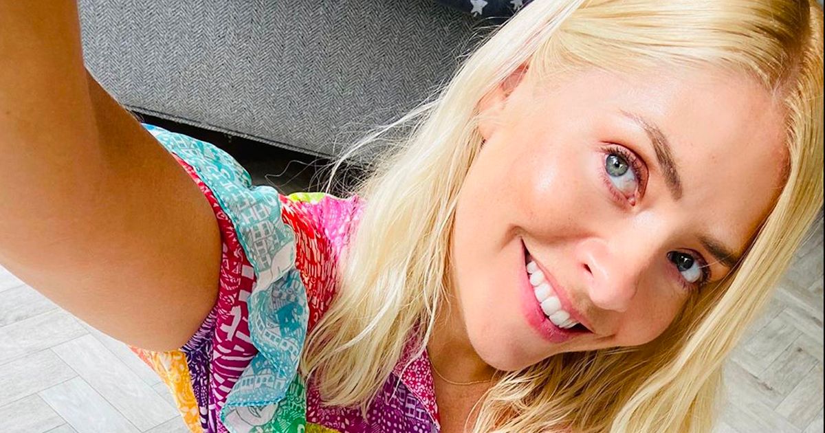 Holly Willoughby shows incredible figure in white swimsuit with throwback pic