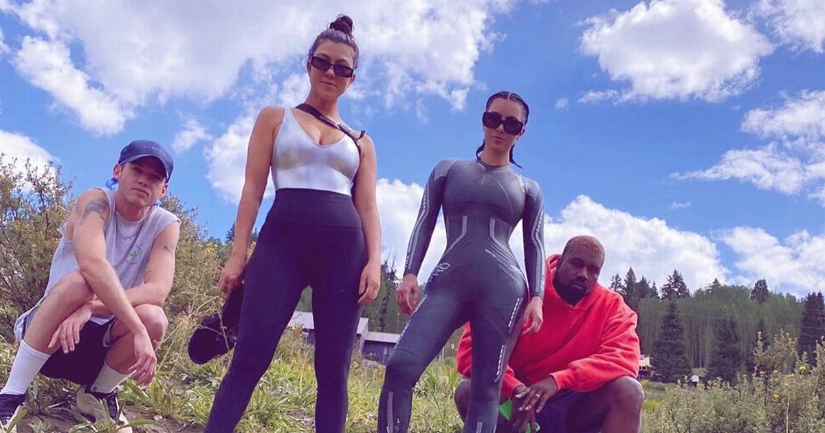 Glum faced Kim and Kanye force smiles for family day at lake amid divorce claims