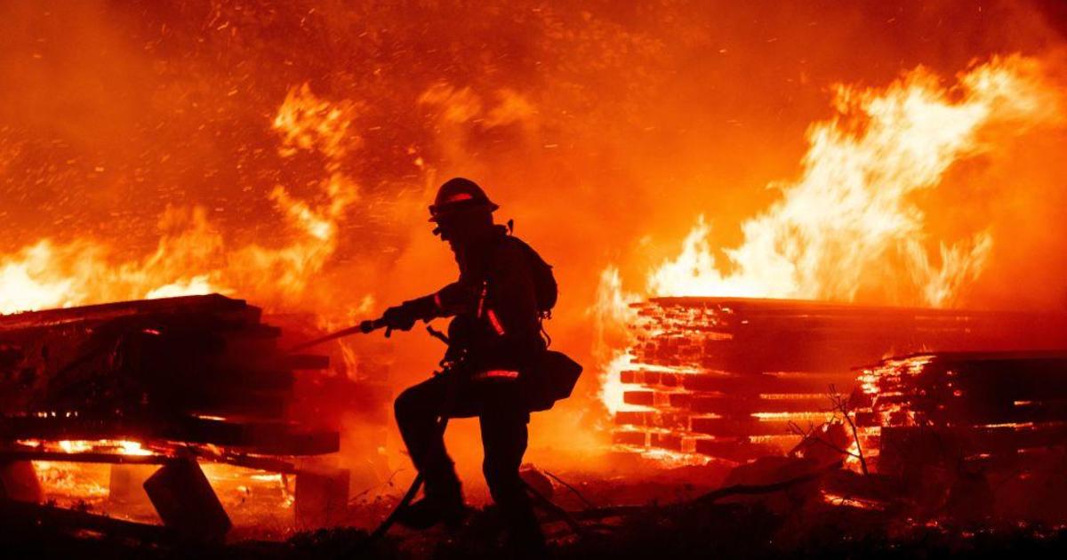 Deadly western wildfires level homes and decimate communities