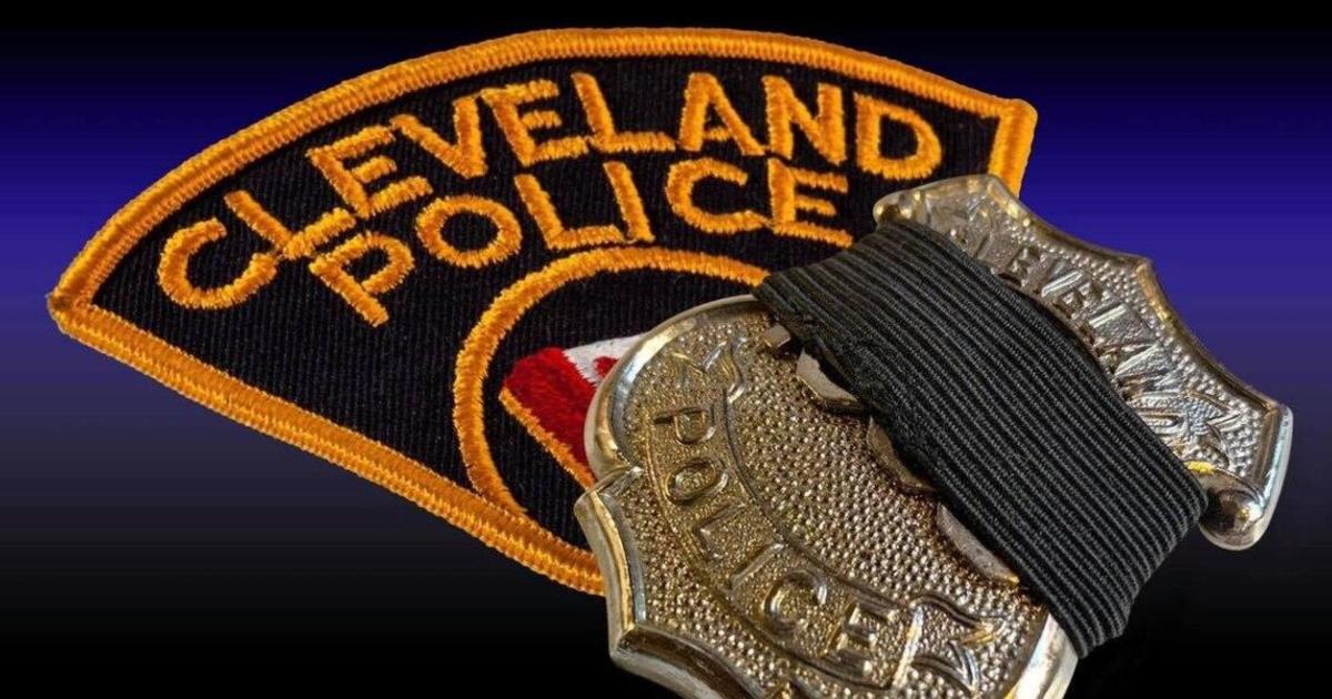 Police search for gunman after Cleveland officer shot dead