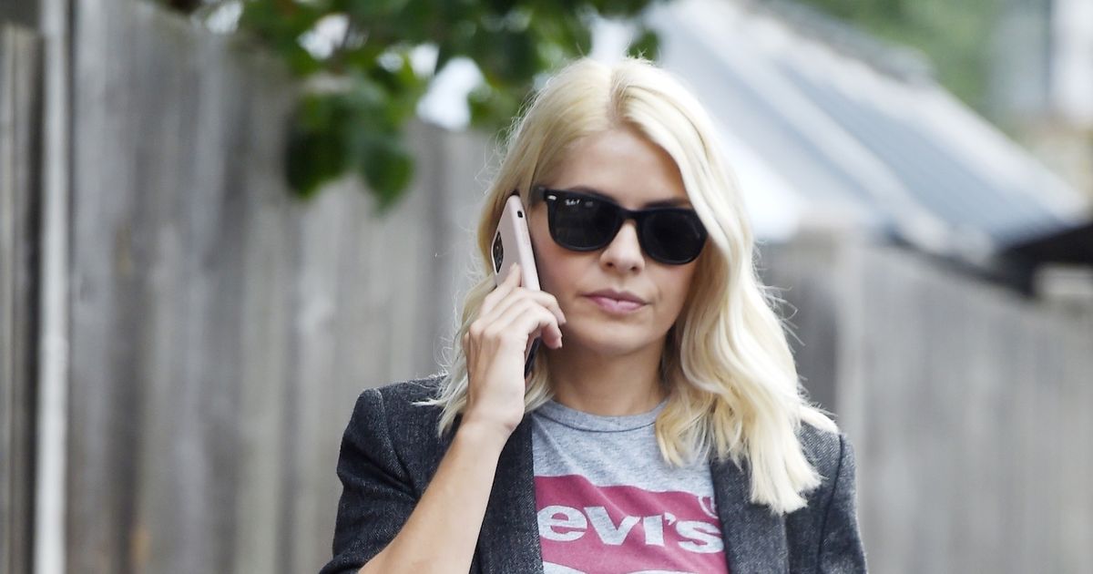 Holly Willoughby oozes class as she struts down the street in clean cut blazer