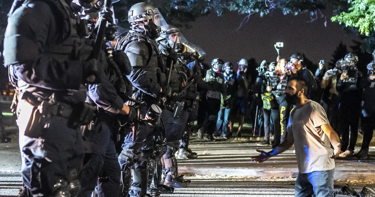 Police declare a riot on 100th night of protests in Portland