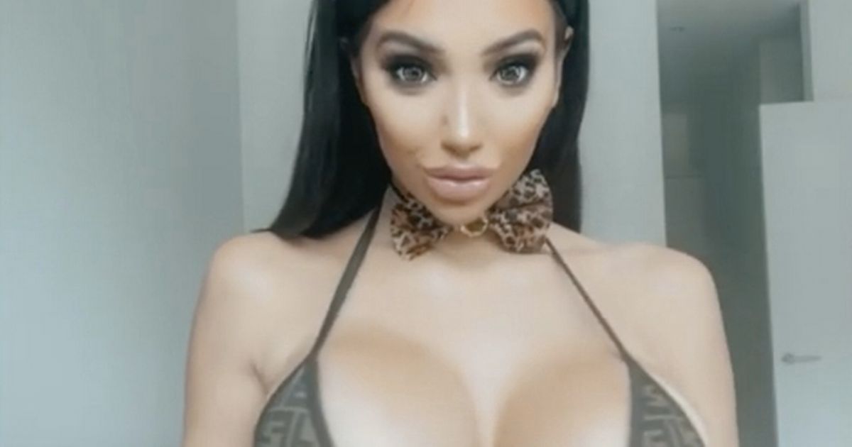 Chloe Khan shocks as she jiggles breasts in tiny bikini while dressed as a cat