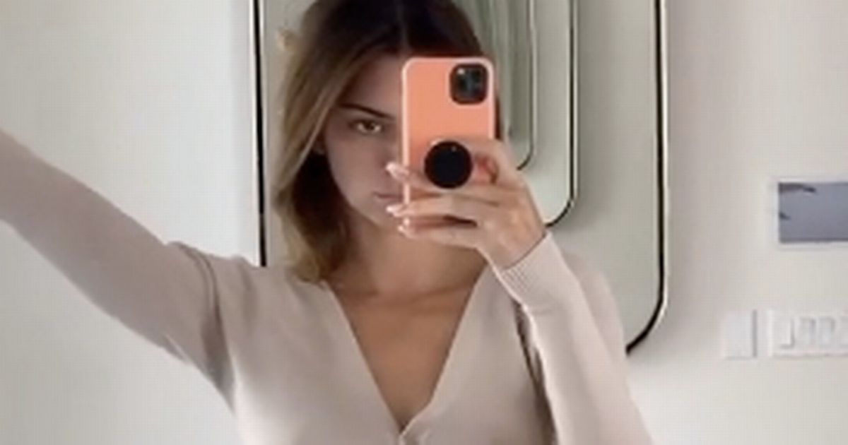 Kendall Jenner risks exposing chest as she poses in perilously held together top