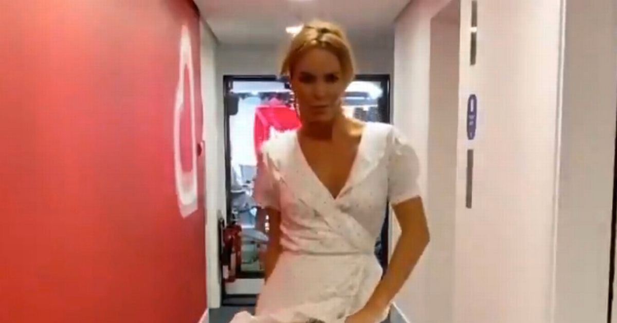 Amanda Holden has a Marilyn moment as she struts through office in white frock