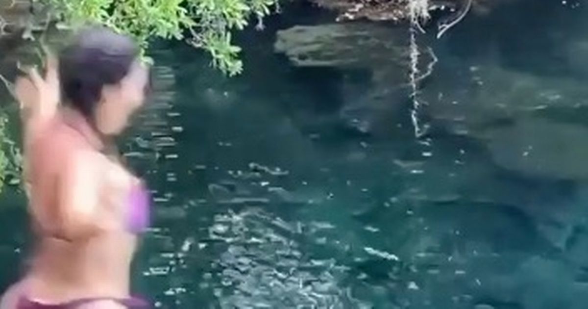 Kim Kardashian shows off enviable figure as she dives into lagoon with her kids