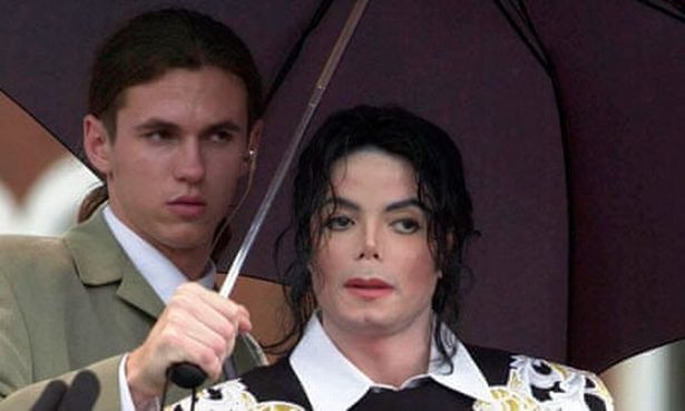 Michael Jackson with his then bodyguard Matt Fiddes (left) in 2002