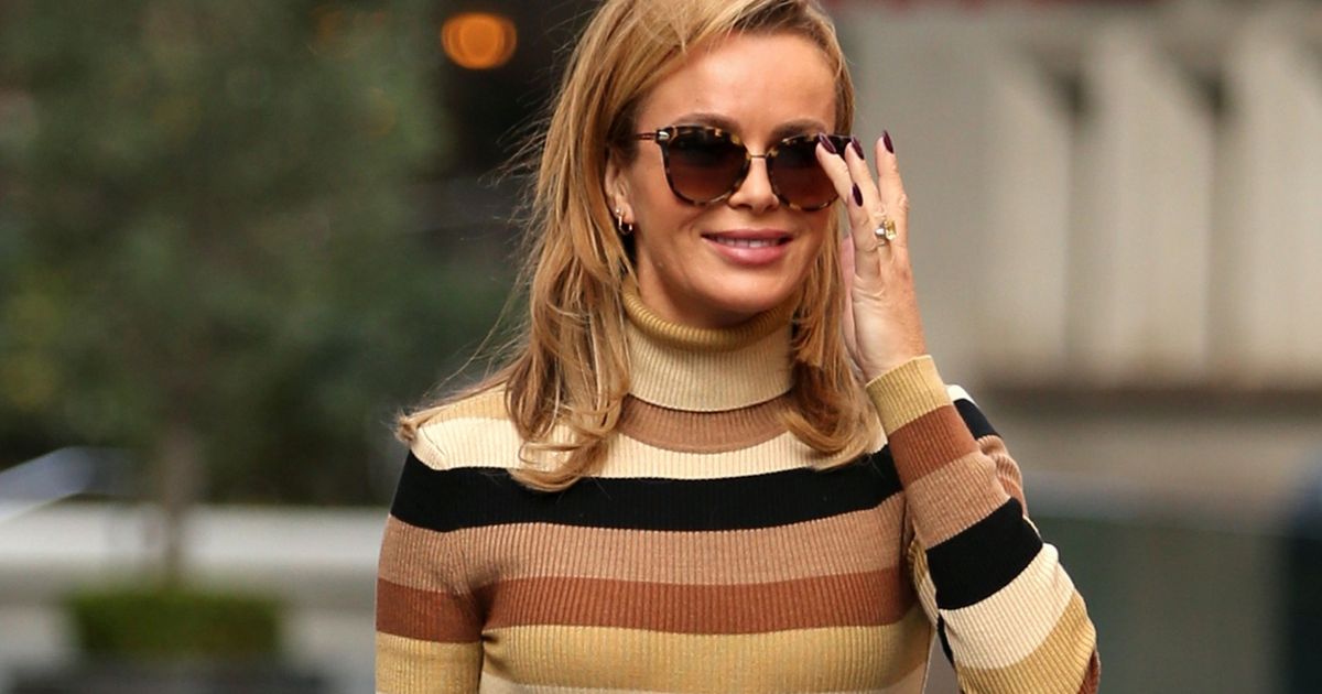 Amanda Holden ditches summer dress for autumnal look in jumper and leather skirt