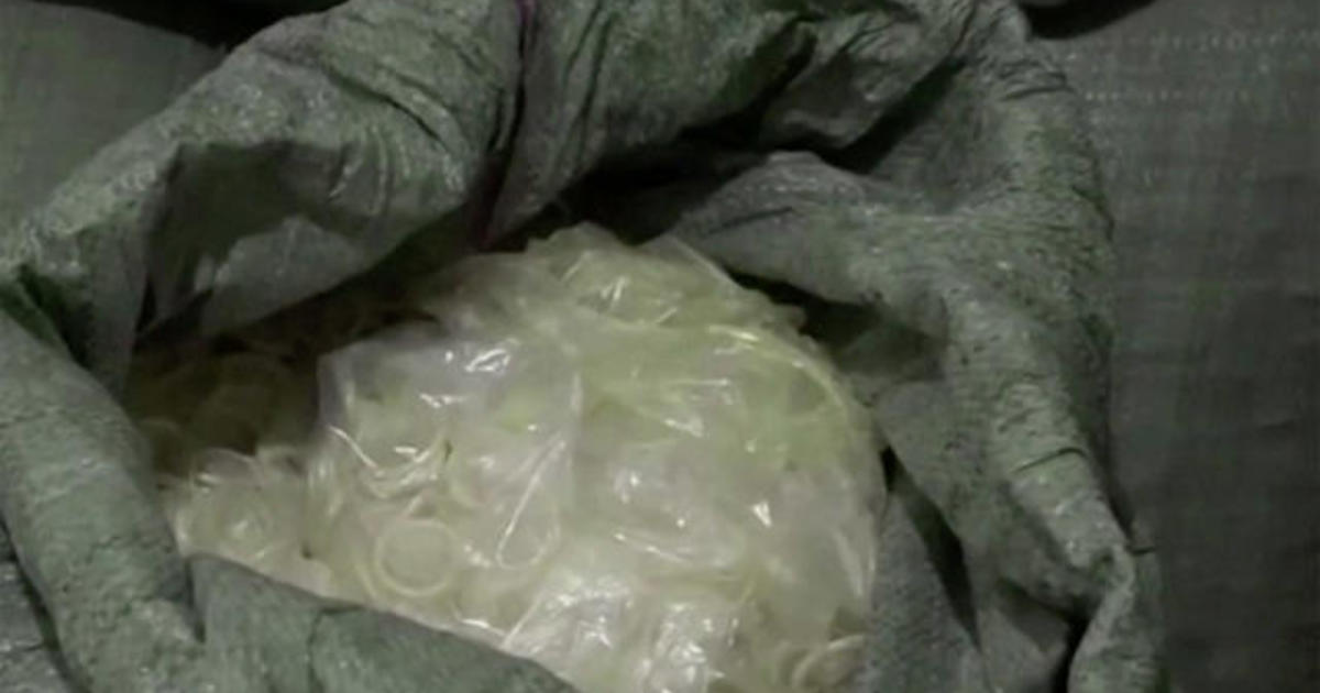 Police in Vietnam raid warehouse recycling used condoms