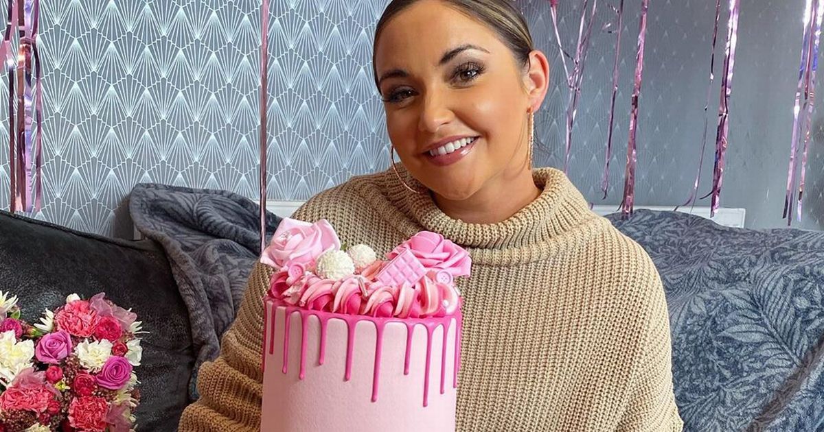 Jacqueline Jossa smiles as she poses with cake after jaw-dropping underwear snap