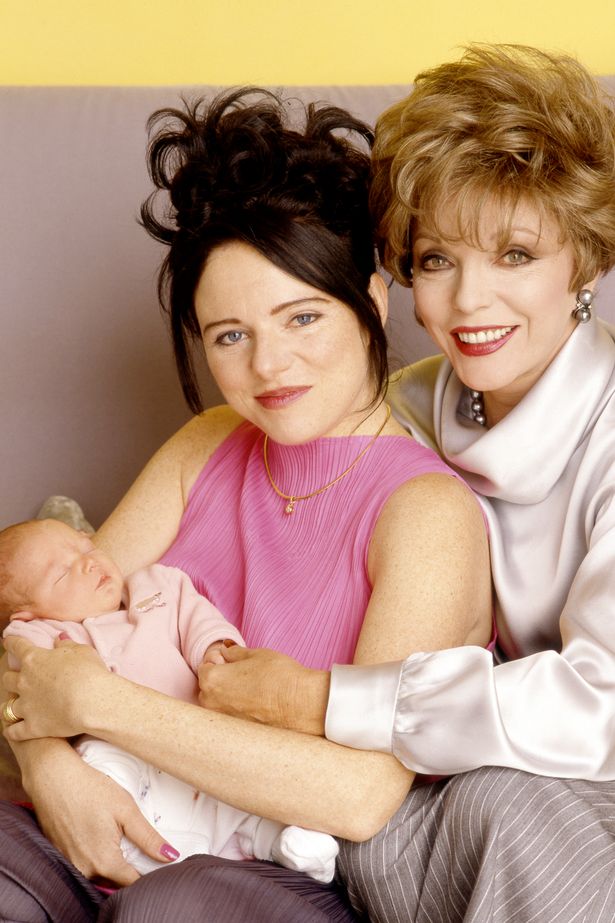 British actress Joan Collins with grandchild Miel Celeste by daughter Tara Newley in 1998