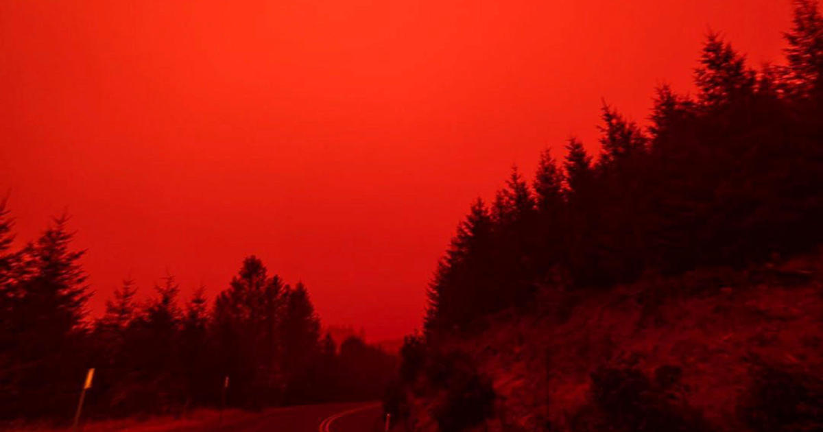 Wildfire photos show “apocalyptic” red skies across Western U.S.