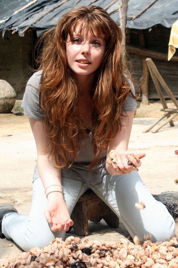 Stacey Dooley with drying out cocoa beans in an early TV job