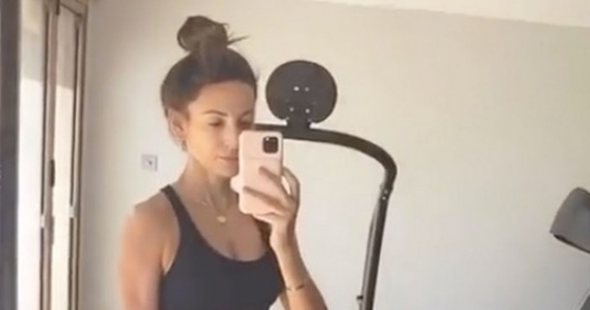 Michelle Keegan shows off washboard abs after completing workout in her home gym