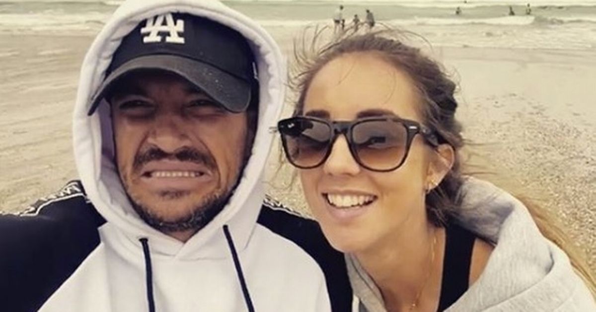 Peter Andre looks miserable during freezing cold day at the beach with Emily