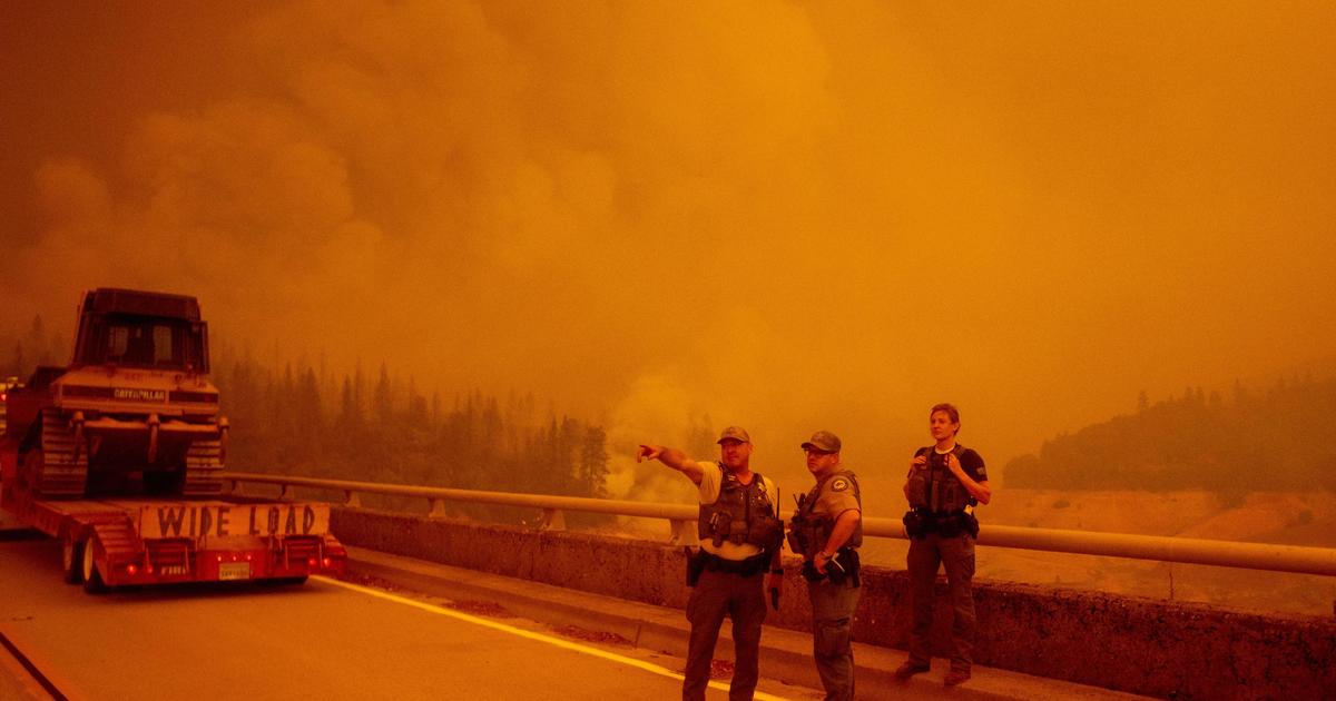 Search on for missing as California fires force thousands to flee