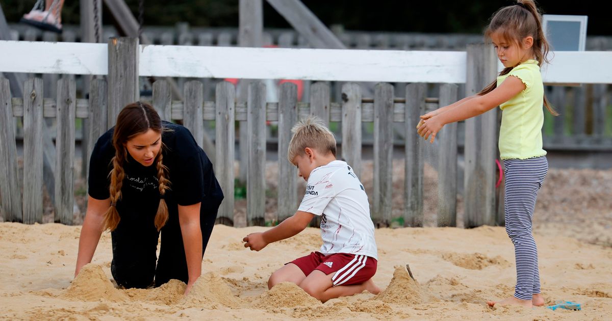 Jacqueline Jossa and Dan Osborne play with their kids in the sand on fun day out