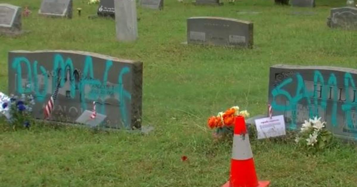 Headstones spray painted in historically Black cemetery in Austin