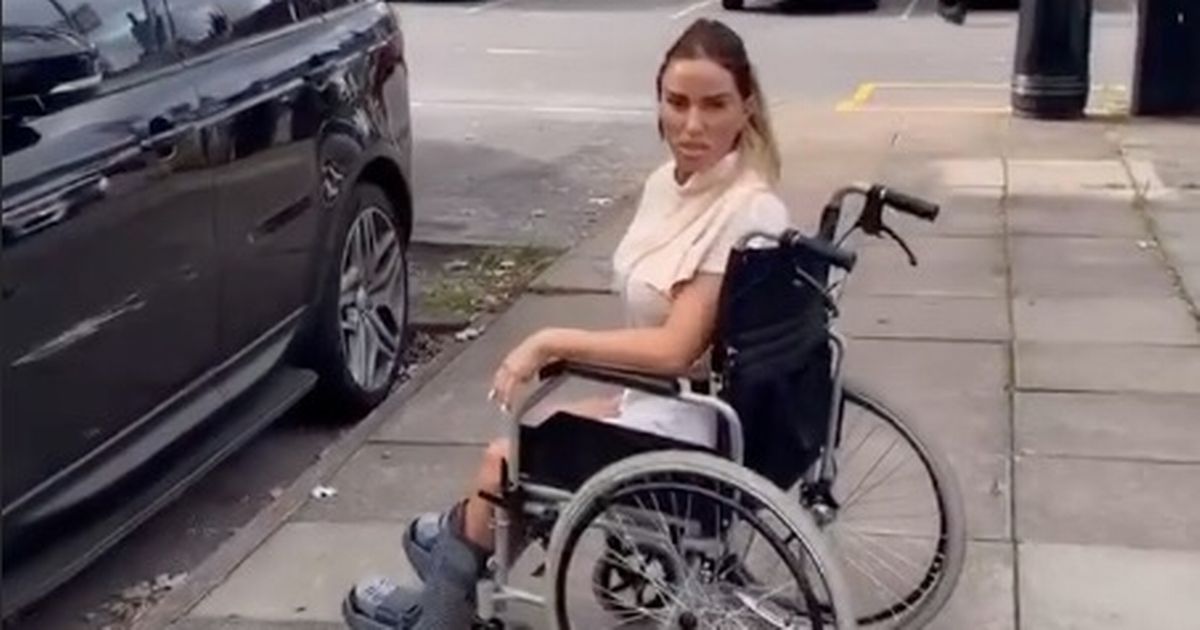 Carl Woods chucks Katie Price in wheelchair as they flaunt playful romance