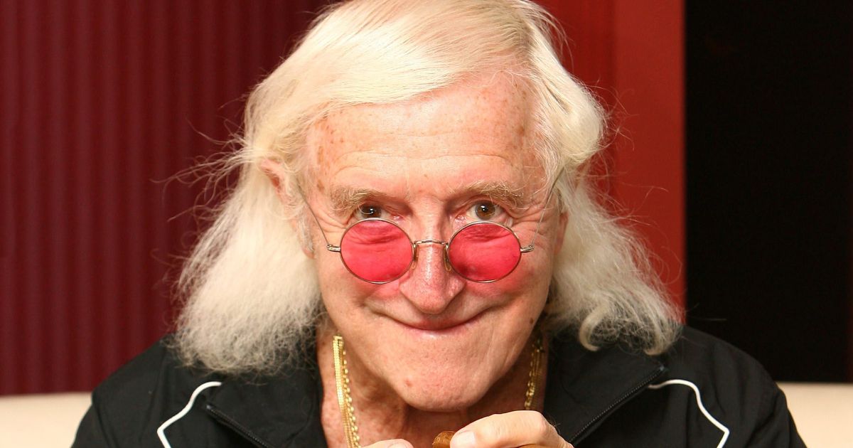 Sick fans still leave flowers on the unmarked grave of paedophile Jimmy Savile