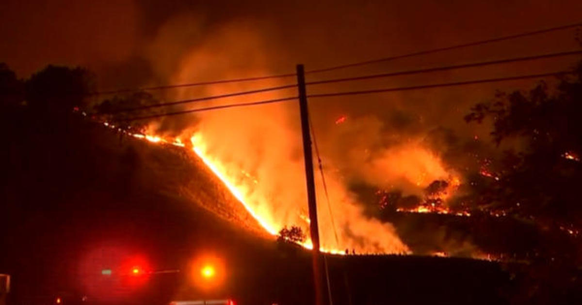 Firefighters struggle to contain deadly blazes in California amid extreme winds