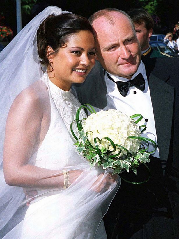 British rock star singer Phil Collins (R) July 1999 marries his former interpreter Orianne Cevey (L) in a exclusive ceremony in the Beau Rivage hotel in Lausanne, Switzerland July 24