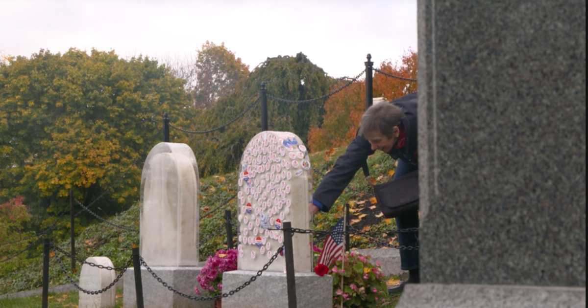 Women pay respect to Susan B. Anthony at her grave in Rochester