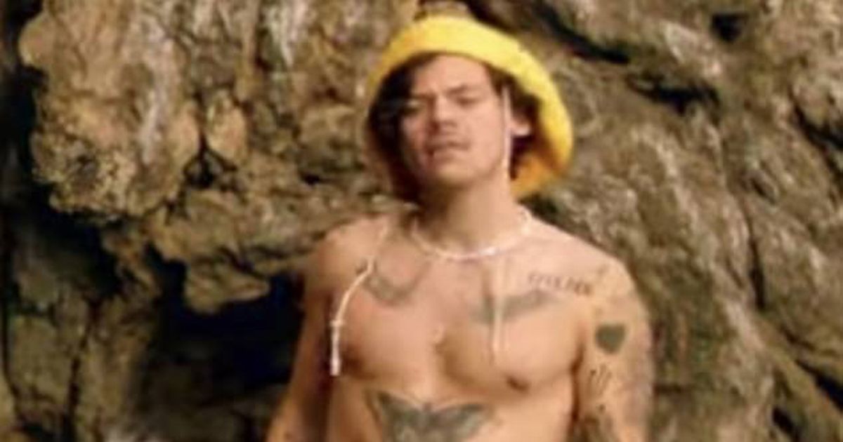 Harry Styles teases fans as he ditches shirt to show off tattoos in music video