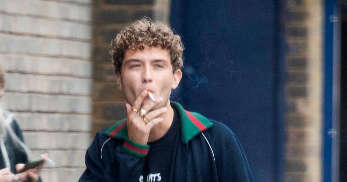 Jude Law’s lookalike model son Rafferty puffs on cigarette outside photoshoot