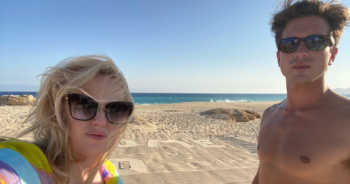 Rebel Wilson swoons over topless boyfriend Jacob Busch on romantic beach getaway