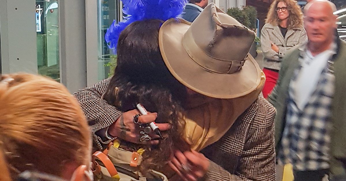 Johnny Depp flouts social distancing rules to hug fan after landing in Zurich