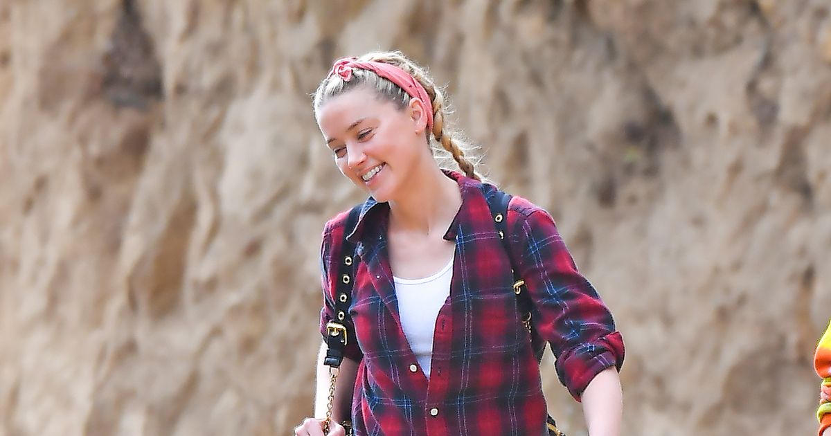 Amber Heard all smiles during hike as Johnny Depp found to be ‘wife-beater’