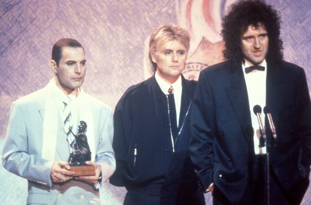 Freddie Mercury in one of his final public appearances with his Queen bandmates Roger Taylor and Brian May