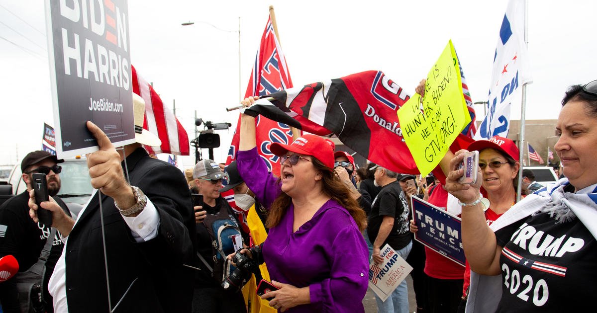 Trump supporters crowd vote counting sites as Biden leads in Arizona