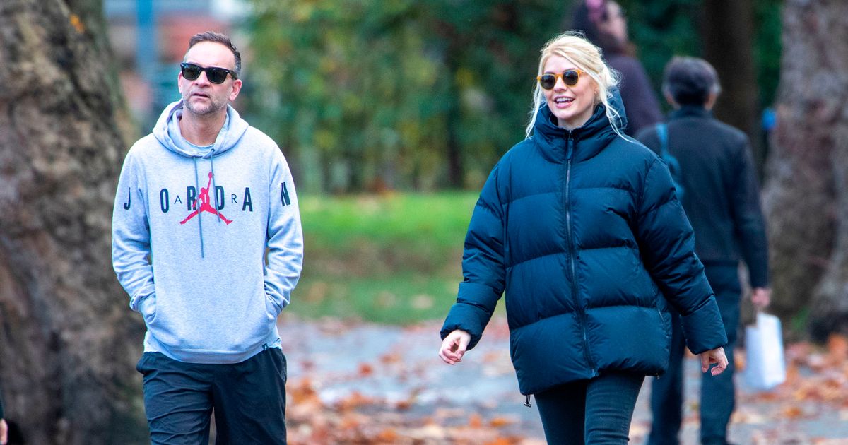 Holly Willoughby looks smitten as she holds husband Dan’s hand in rare snaps