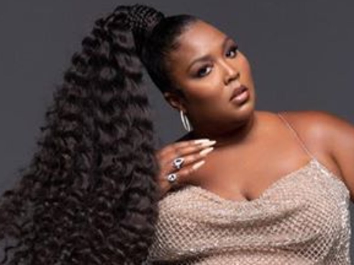 Lizzo Puts Her Beach Body On Full Display In PrettyLittleThing Snake Two Piece Bathing Suit