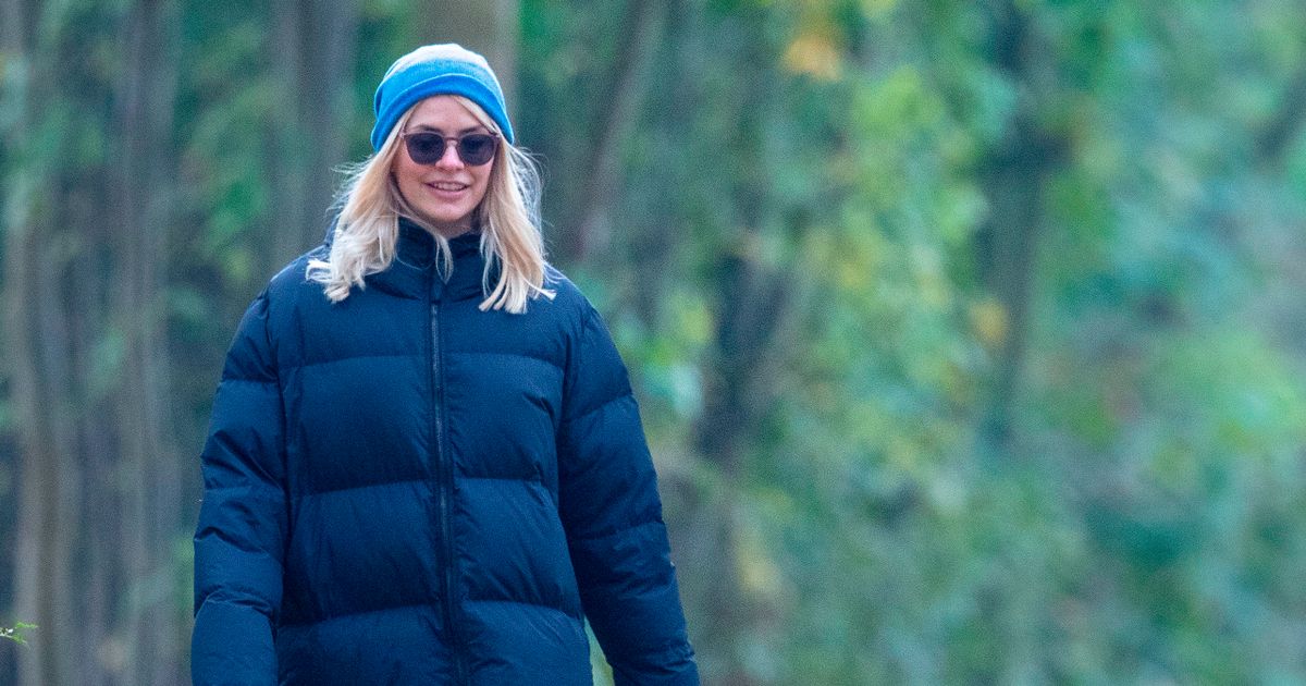 Holly Willoughby nails winter chic in designer coat as she wraps up on dog walk