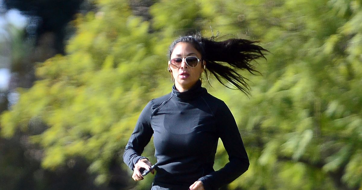 Nicole Scherzinger displays her impressive flexibility skills during workout