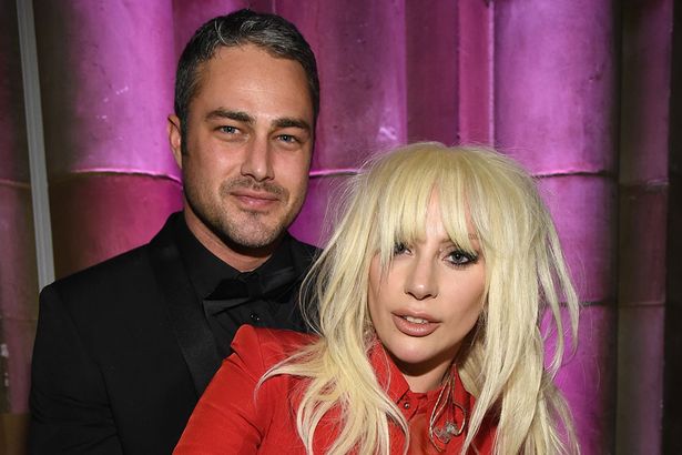 Taylor Kinney (L) and Lady Gaga attend Billboard Women In Music 2015